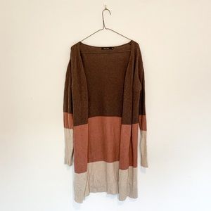 Brown, cream, and orange cardigan sweater